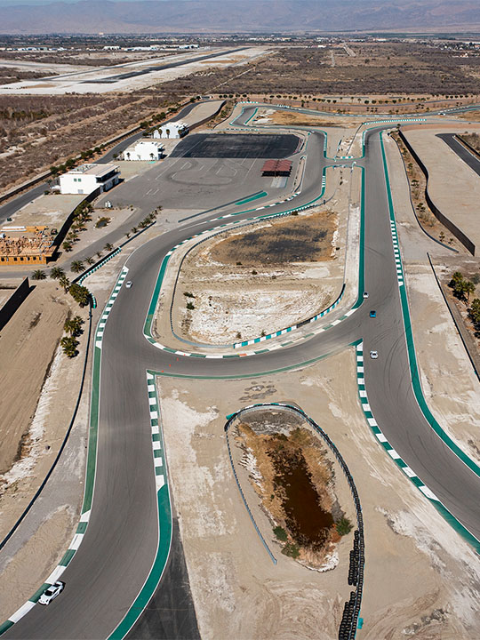 Aerial view of Desert Circuit with green-and-white curbing